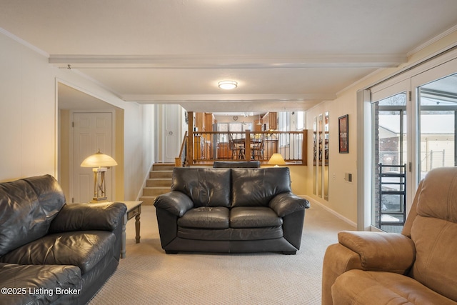 living room featuring a wealth of natural light, carpet, stairway, and beam ceiling