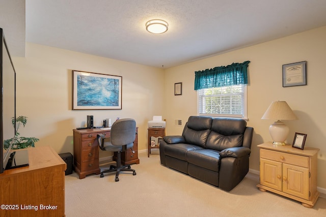 office featuring light carpet and baseboards