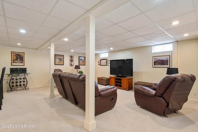 living room featuring a paneled ceiling, light colored carpet, and recessed lighting