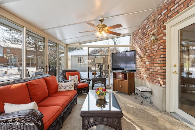 sunroom / solarium featuring vaulted ceiling and ceiling fan