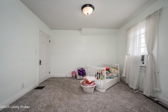 unfurnished bedroom with baseboards, carpet floors, and visible vents