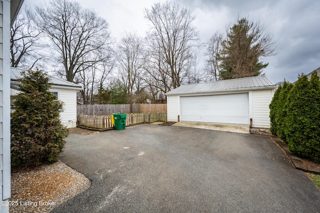 detached garage with fence