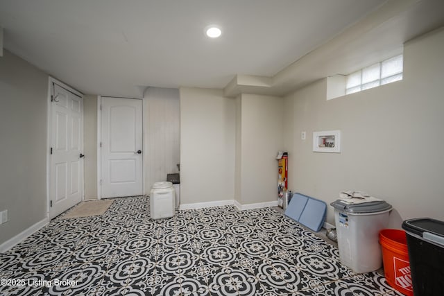 basement with recessed lighting and baseboards