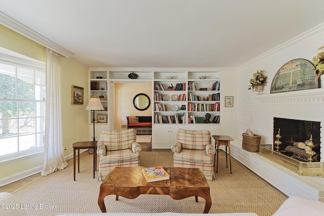 living area with built in shelves, a fireplace, baseboards, and ornamental molding