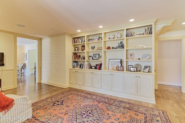 sitting room featuring recessed lighting, baseboards, light wood-style floors, and ornamental molding