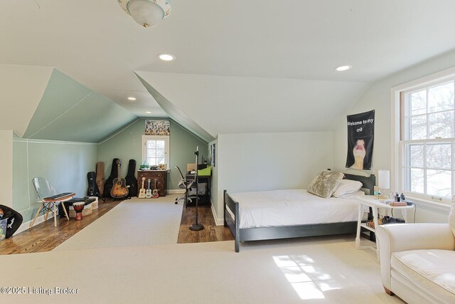 bedroom featuring vaulted ceiling, recessed lighting, wood finished floors, and baseboards