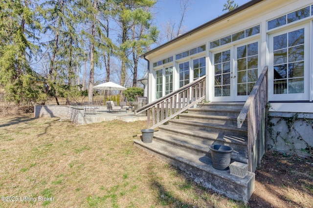 exterior space with french doors, entry steps, and a patio area