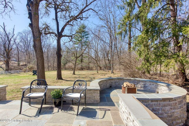 view of patio featuring an outdoor fire pit