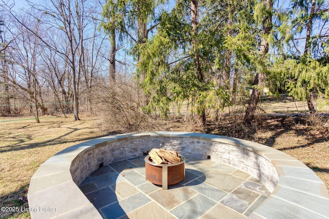 view of patio / terrace featuring a fire pit