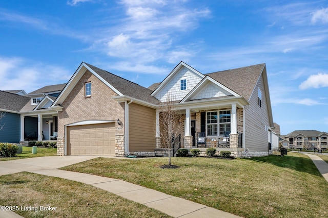 craftsman inspired home with covered porch, a shingled roof, brick siding, concrete driveway, and a front lawn