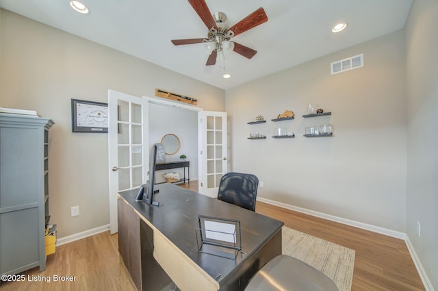 office area with french doors, visible vents, ceiling fan, light wood-type flooring, and baseboards