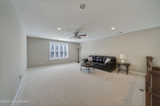 living area featuring a ceiling fan, carpet, visible vents, and baseboards