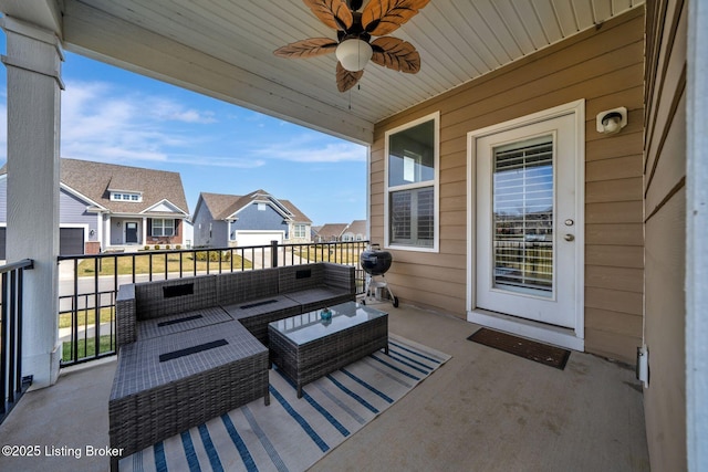 view of patio / terrace with ceiling fan, outdoor lounge area, a balcony, and a residential view