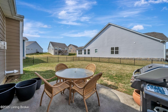 view of patio / terrace featuring a fenced backyard, a residential view, area for grilling, and outdoor dining space