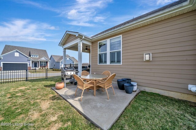 view of patio / terrace with fence, grilling area, a ceiling fan, and outdoor dining space