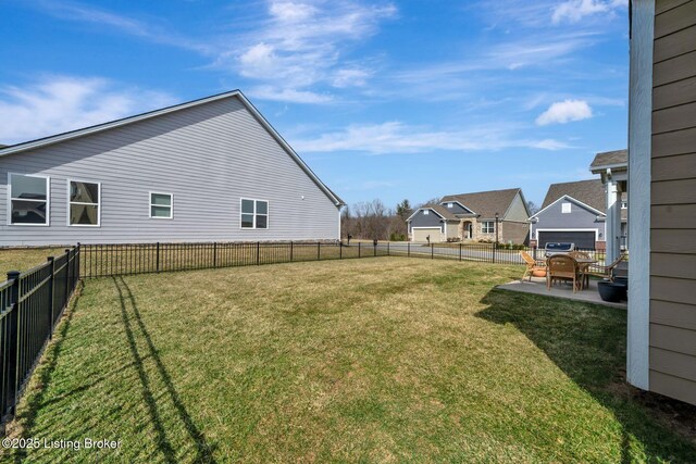 view of yard featuring a patio area and a fenced backyard