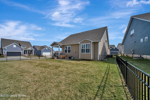 rear view of house featuring a yard, a patio area, a fenced backyard, and a residential view