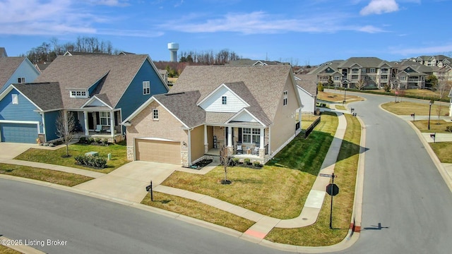 traditional-style home featuring driveway, a residential view, a porch, roof with shingles, and a front lawn