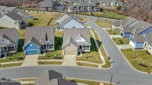 birds eye view of property with a residential view