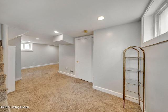 below grade area featuring recessed lighting, carpet flooring, stairway, and baseboards