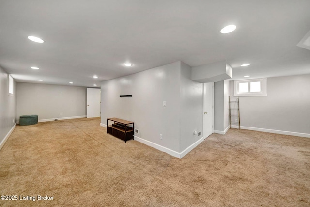 below grade area with carpet floors, recessed lighting, and baseboards