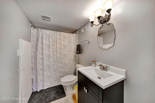 bathroom featuring a shower with curtain, visible vents, vanity, and toilet