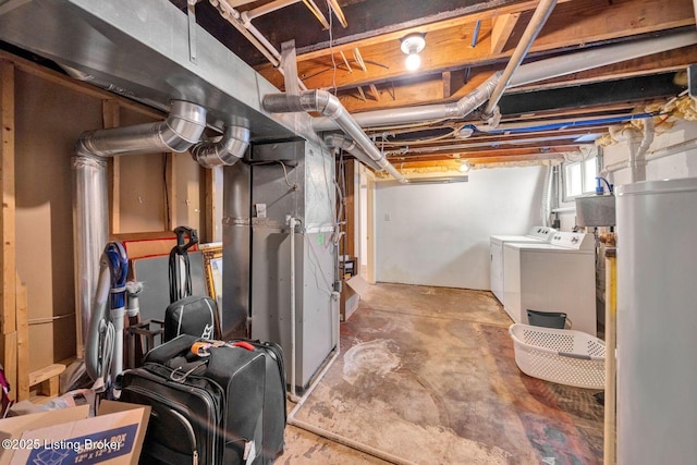 below grade area featuring washer and dryer and water heater