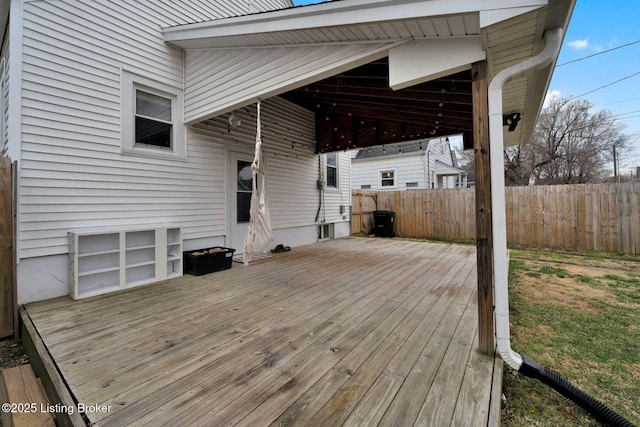 wooden terrace featuring fence