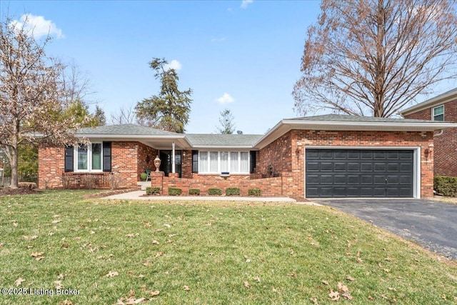 ranch-style home with an attached garage, aphalt driveway, a front yard, and brick siding