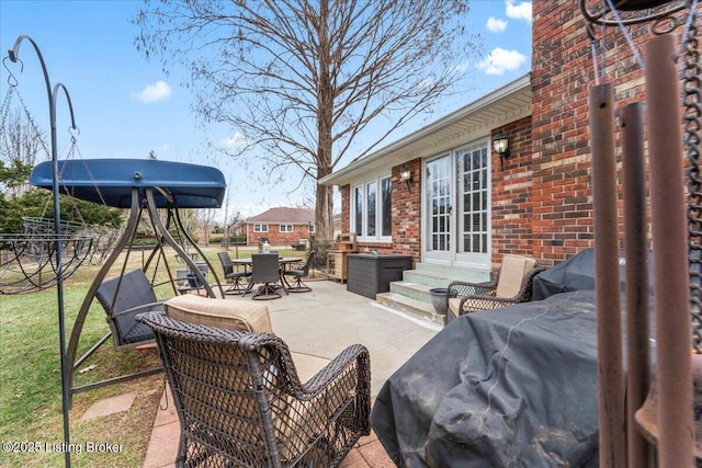 view of patio / terrace with entry steps and outdoor dining space