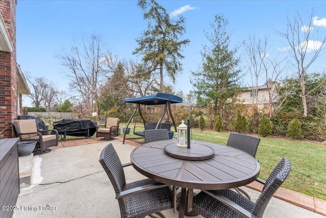 view of patio / terrace featuring a grill and outdoor dining area