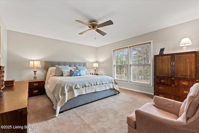 bedroom with carpet floors, ceiling fan, and baseboards