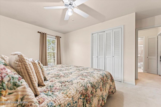 bedroom with baseboards, a closet, a ceiling fan, and light colored carpet