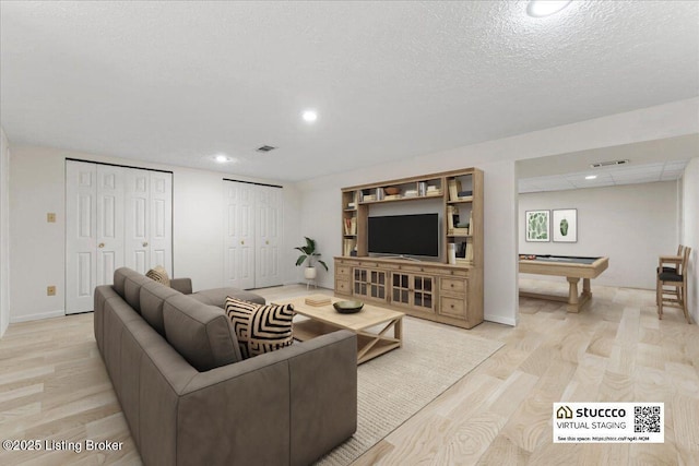 living area with light wood finished floors, recessed lighting, visible vents, and pool table