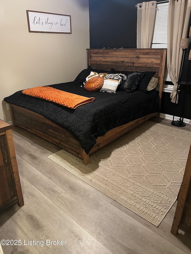 bedroom featuring wood finished floors