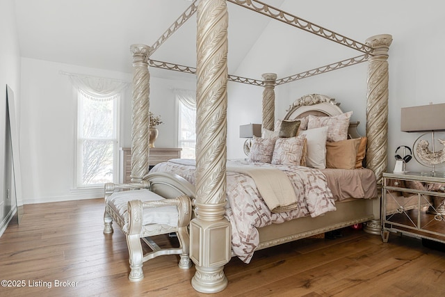 bedroom with hardwood / wood-style flooring