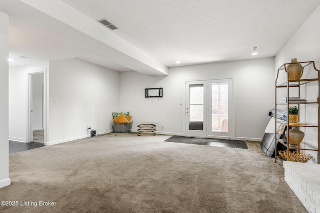 interior space with carpet, visible vents, baseboards, and recessed lighting