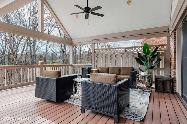 wooden terrace featuring outdoor lounge area and a ceiling fan