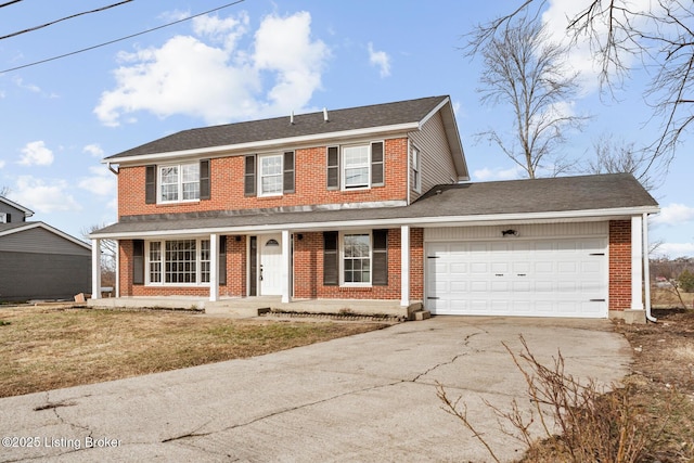 view of front of home with a garage, driveway, and brick siding