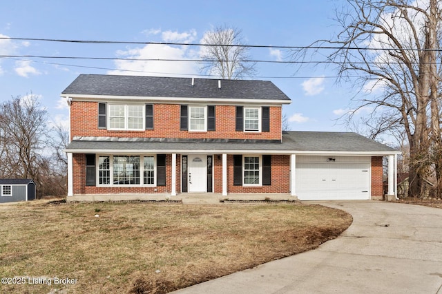 view of front of home with brick siding, a porch, concrete driveway, a front yard, and a garage