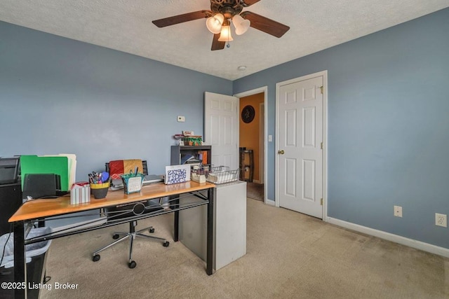 home office with ceiling fan, light colored carpet, baseboards, and a textured ceiling