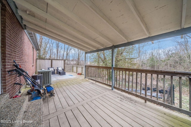 wooden terrace featuring central AC unit