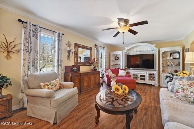 living room with a ceiling fan, ornamental molding, and wood finished floors