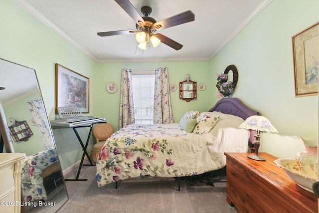 carpeted bedroom featuring baseboards, ornamental molding, and ceiling fan