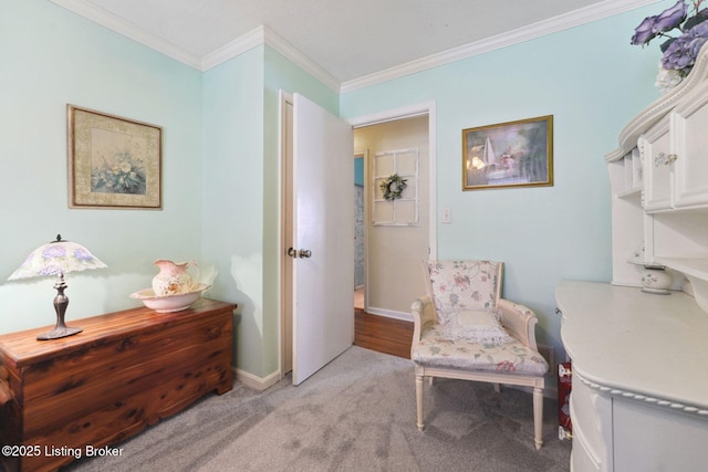 living area featuring light carpet, baseboards, and ornamental molding