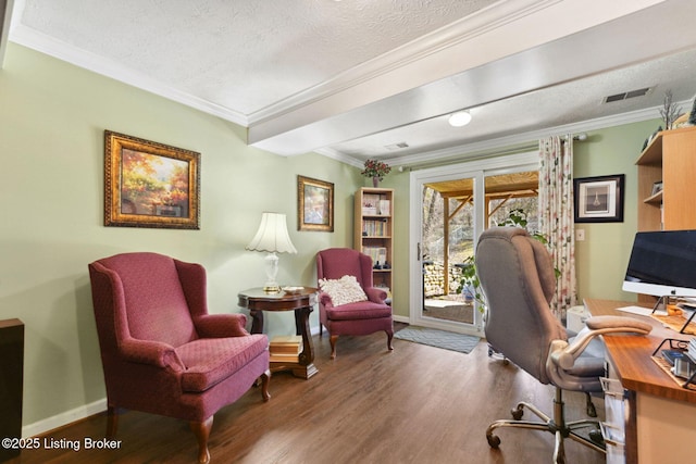 office area featuring crown molding, visible vents, a textured ceiling, wood finished floors, and baseboards