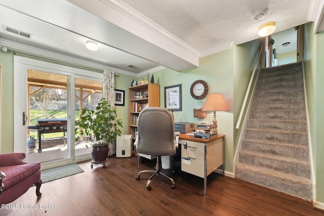 home office featuring baseboards, visible vents, dark wood-type flooring, crown molding, and a textured ceiling