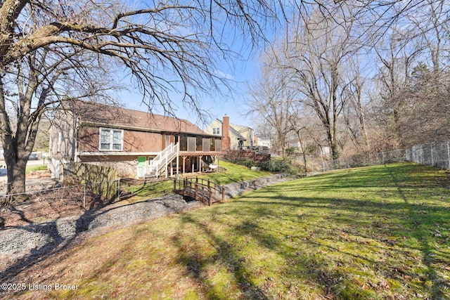 view of yard featuring stairway and fence