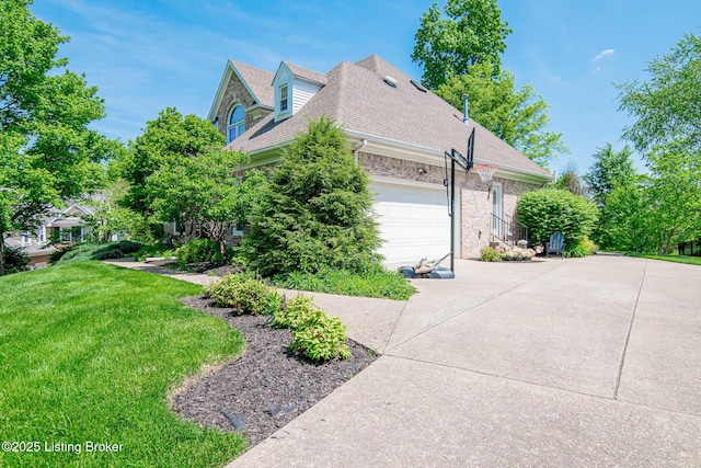 view of side of home with a garage, a lawn, concrete driveway, roof with shingles, and brick siding