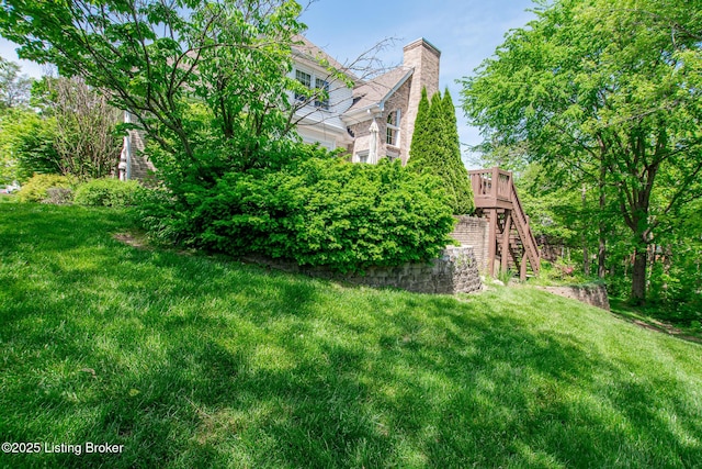 view of yard with stairway and a wooden deck